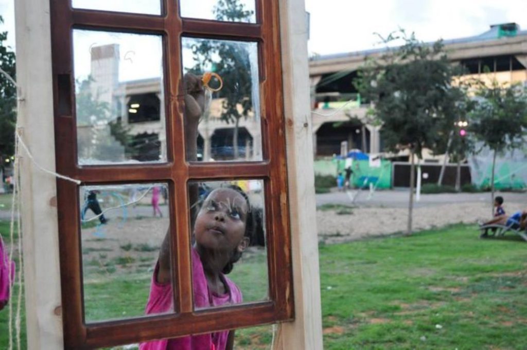 [A pop-up "white night" in collaboration with the community in the garden adjacent to the Tel Aviv Central Bus Station]