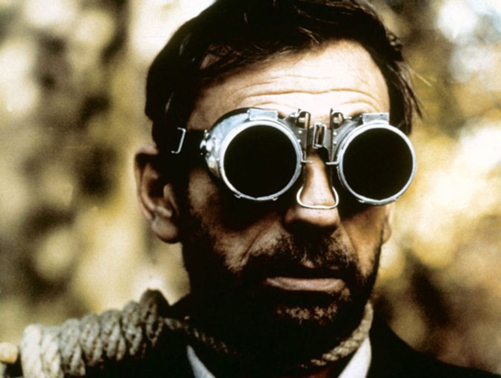 Yves Montand in L'aveau wearing the protective goggles